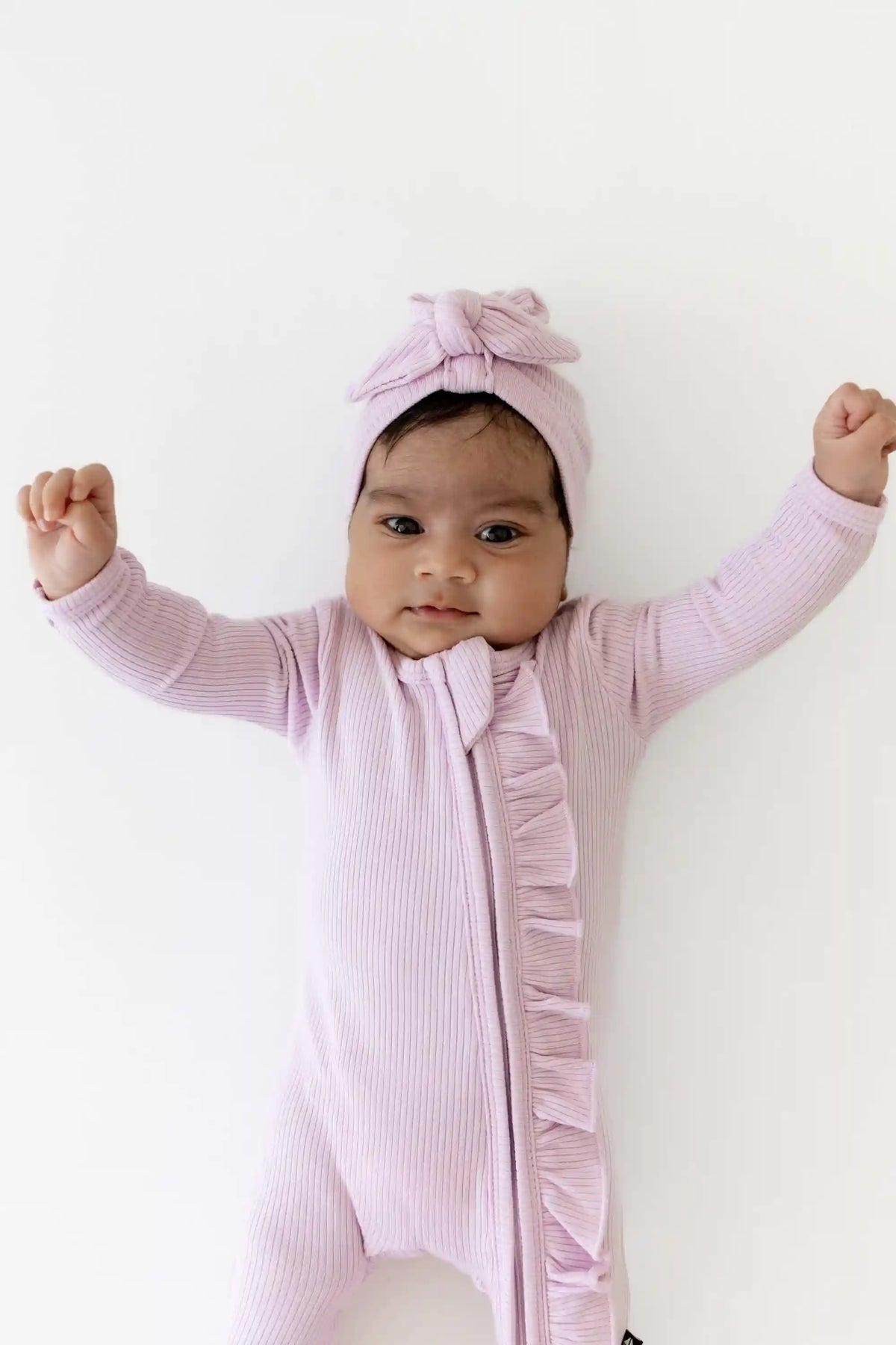 Ribbed Ruffle Zipper Footie in Thistle